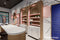 Murano B | Arcades | Counter back wall with lit shelving