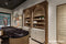 Murano A | Arcades | Counter back wall with lit shelving